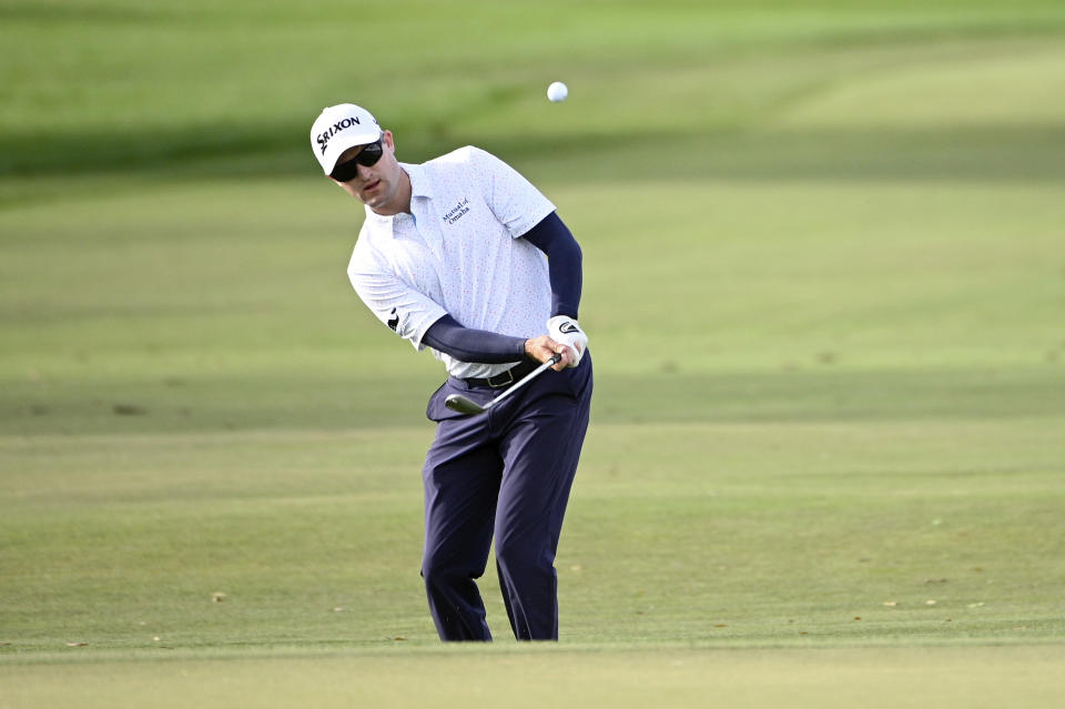 FILE - In this March 5, 2020, file photo, Russell Knox, of Scotland, chips onto the sixth green during the first round of the Arnold Palmer Invitational golf tournament in Orlando, Fla. Knox plans to drive his RV some 1,000 miles each way to PGA Tour events when they resume. (AP Photo/Phelan M. Ebenhack, File)