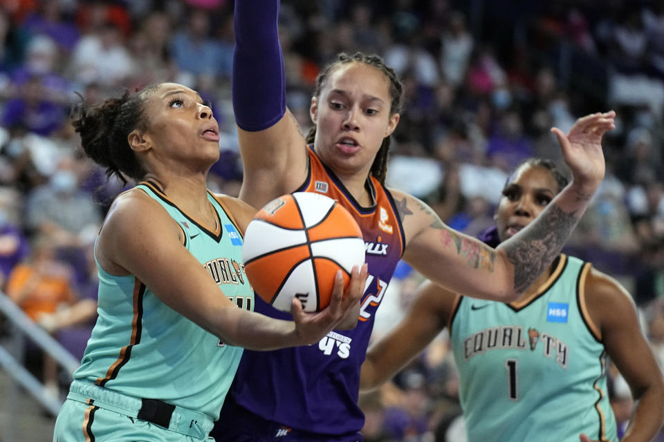 New York Liberty guard/forward Betnijah Laney (44) shoots in front of Phoenix Mercury center Brittney Griner (42) during the second half in the first round of the WNBA basketball playoffs, Thursday, Sept. 23, 2021, in Phoenix. Phoenix won 83-82. (AP Photo/Rick Scuteri)