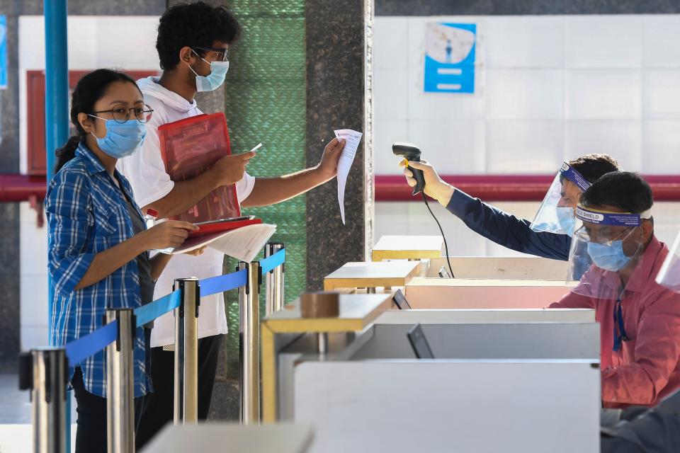 Students arrive at an examination centre for Joint Entrance Examination (JEE ) Main-2020, one of the most competitive entrance exams for entry to top national engineering colleges, in Noida on September 1, 2020. (Photo by Prakash SINGH / AFP) (Photo by PRAKASH SINGH/AFP via Getty Images)