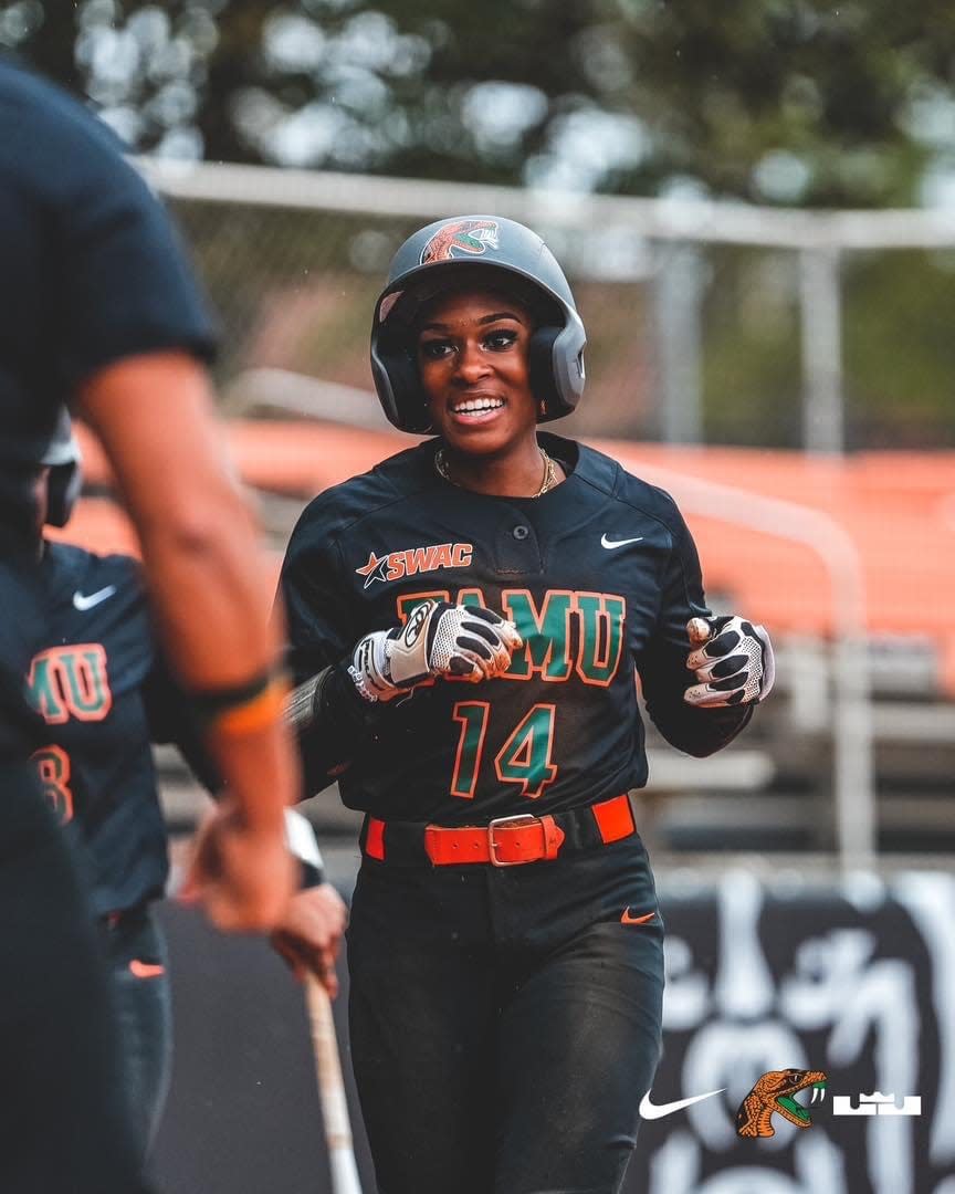 Florida A&M University softball outfielder Jania Davis (14) rejoices as she approaches home plate during a game against Hampton University at the Mercer Tournament in Macon, Georgia, Friday, Feb. 10, 2023