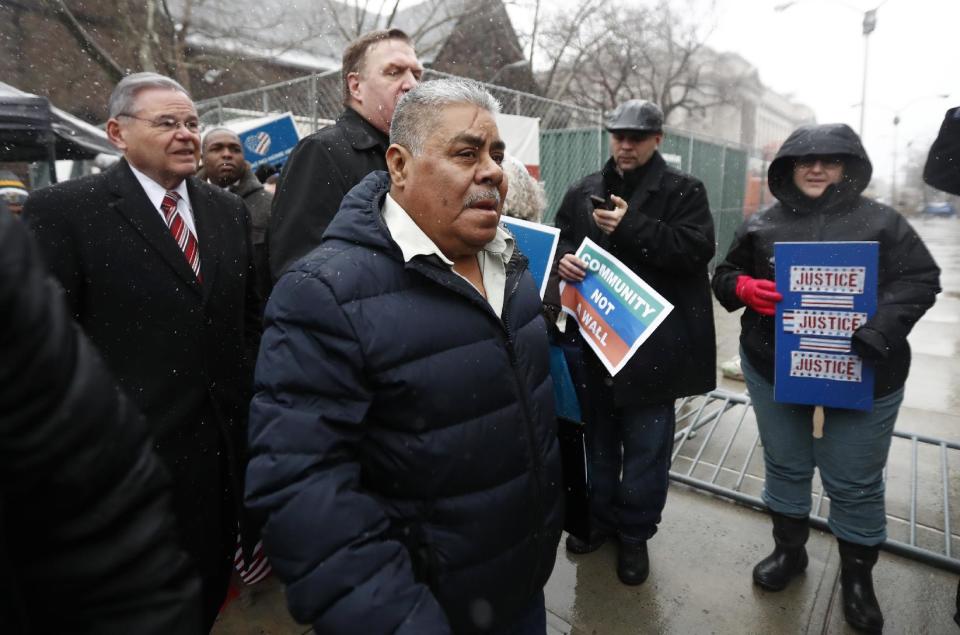 Catalino Guerrero, center, walks with U.S. Sen. Bob Menendez, left, and Newark Archbishop Cardinal Joseph Tobin, center left, during a rally outside of the Peter Rodino Federal Building before attending an immigration hearing, Friday, March 10, 2017, in Newark, N.J. Guerrero, who arrived in the U.S. illegally in 1991, is facing deportation. Organizers claim he is an upstanding citizen and should not be deported. (AP Photo/Julio Cortez)