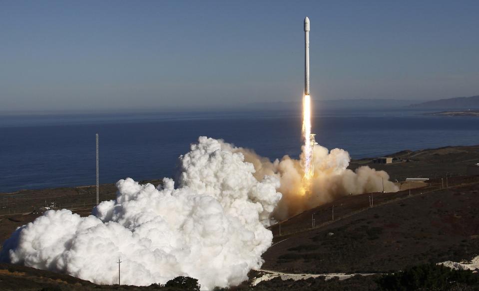 A Falcon 9 rocket carrying a small science satellite for Canada is seen as it is launched from a newly refurbished launch pad in Vandenberg Air Force Station