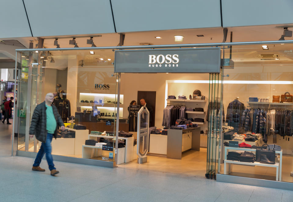 A Hugo Boss shop window in Tegel Airport. It is a German luxury fashion house founded in 1924 by Hugo Boss. Credit: Getty.