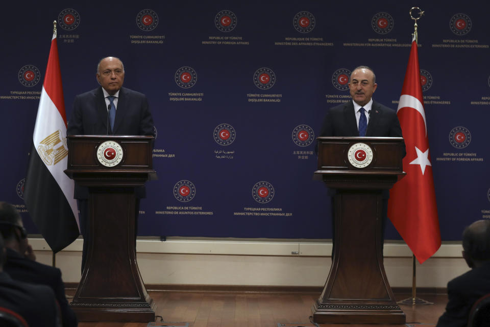 Turkish Foreign Minister Mevlut Cavusoglu, right, and his Egyptian counterpart Sameh Shoukry speak to the media after their talks, in Ankara, Turkey, Thursday, April 13, 2023. (AP Photo/Burhan Ozbilici)