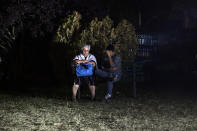 <p>People sit on a bench in front of a makeshift camp set up inside a gymnasium following an earthquake, in Amatrice, central Italy, Thursday, Aug. 25, 2016. (AP Photo/Andrew Medichini) </p>