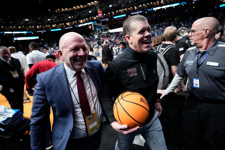 Mar 17, 2023; Columbus, Ohio, USA;  Fairleigh Dickinson Knights head coach Tobin Anderson and athletic director Brad Hurlbut leave the court following their 63-58 win over the Boilermakers during the first round of the NCAA men’s basketball tournament at Nationwide Arena. Mandatory Credit: Adam Cairns-The Columbus Dispatch