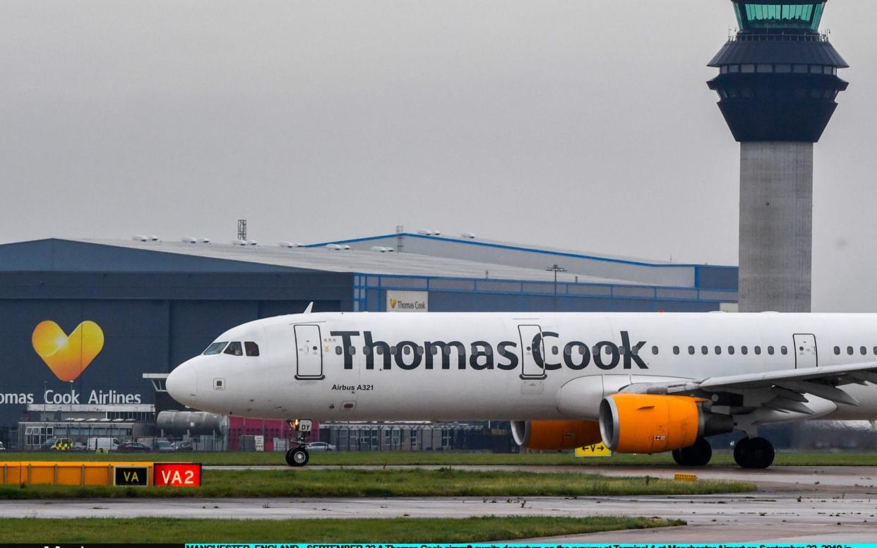 A Thomas Cook aircraft awaits departure on the runway at Terminal 1 at Manchester Airport - Getty Images Europe