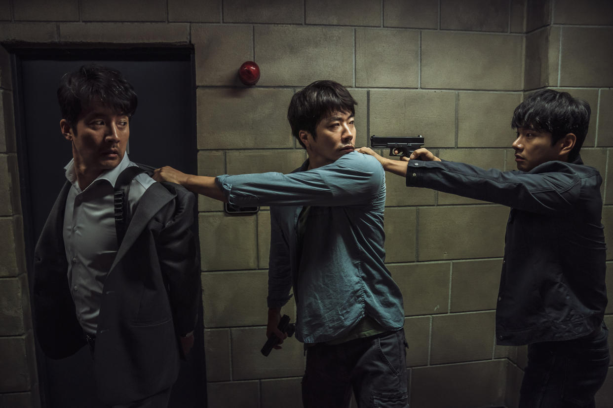 Kwon Sang-woo (centre) stars in Hitman: Agent Jun. (PHOTO: Golden Village Pictures)