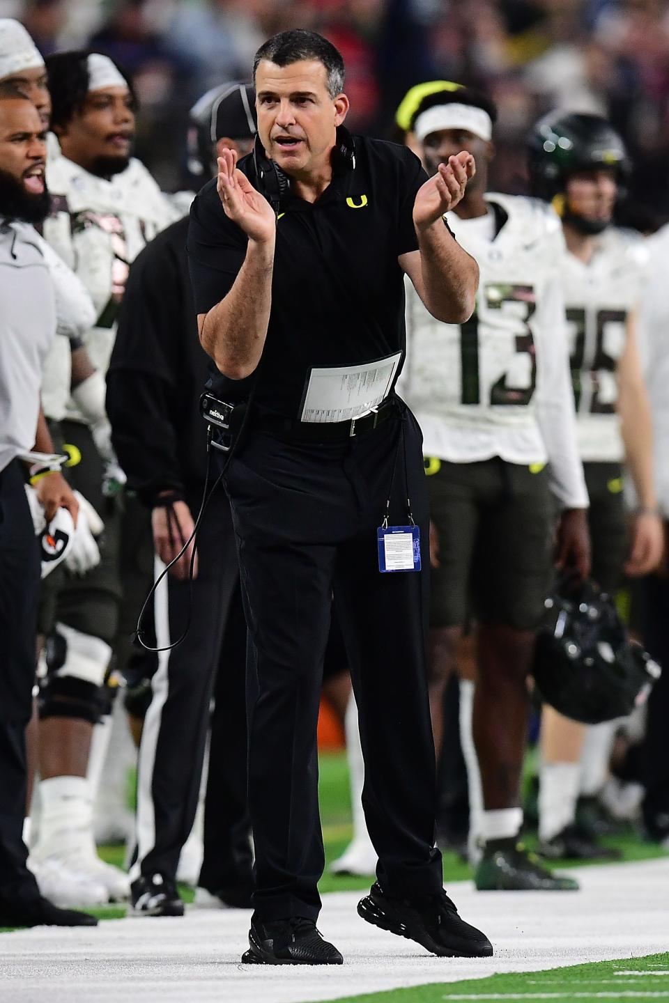 December 3, 2021; Las Vegas, NV, USA; Oregon Ducks head coach Mario Cristobal watches game action against the Utah Utes during the first half in the 2021 Pac-12 Championship Game at Allegiant Stadium. Mandatory Credit: Gary A. Vasquez-USA TODAY Sports