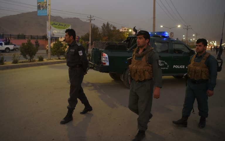 Afghan security personnel patrol near the site of a suicide bomb attack near a military academy base in Kabul on October 21, 2017