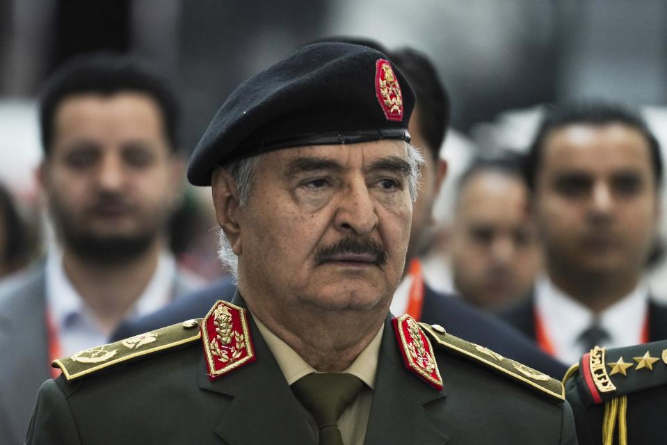Libya's Khalifa Hifter, the commander of the self-styled Libyan National Army, is seen at the International Defense Exhibition and Conference in Abu Dhabi, United Arab Emirates, Monday, Feb. 20, 2023. Just outside of Abu Dhabi's biennial arms fair in a large tent, Russia offered weapons for sale Monday ranging from Kalashnikov assault rifles to missile systems despite facing sanctions from the West over its war on Ukraine. (AP Photo/Jon Gambrell)