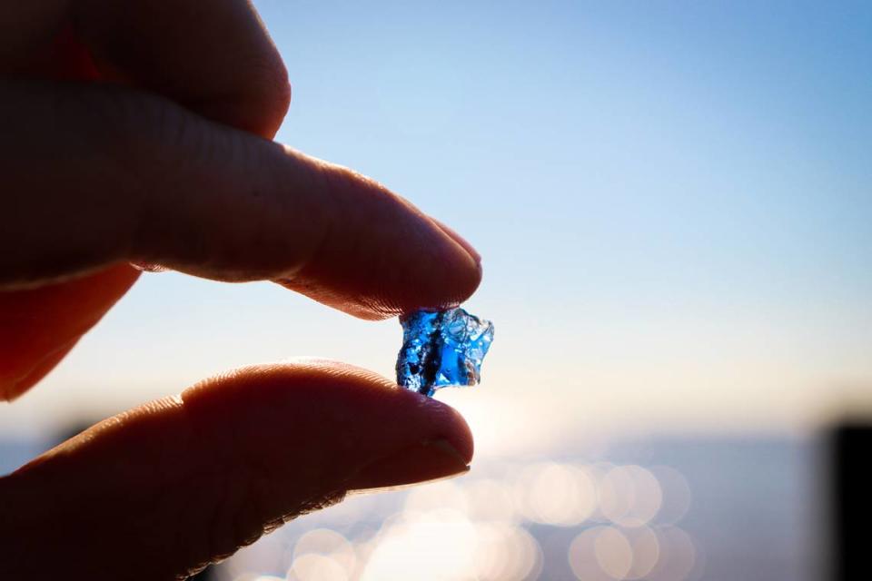 A sliver of glass from an old bottle forms a prism of sunlight through which shines the colors of history. Part of the litter of small debris on the muddy beach along the Beaufort River, it is a reminder of hundreds of years of European settlement in Beaufort and Port Royal. 