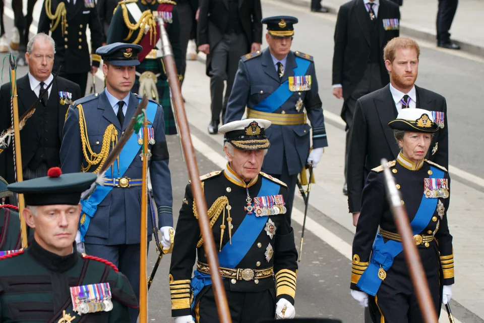 (left to right) The Prince of Wales, King Charles III, the Princess Royal and the Duke of Sussex following the State Gun Carriage carries the coffin of Queen Elizabeth II, draped in the Royal Standard with the Imperial State Crown and the Sovereign's orb and sceptre, in the Ceremonial Procession during her State Funeral at Westminster Abbey, London. Picture date: Monday September 19, 2022.