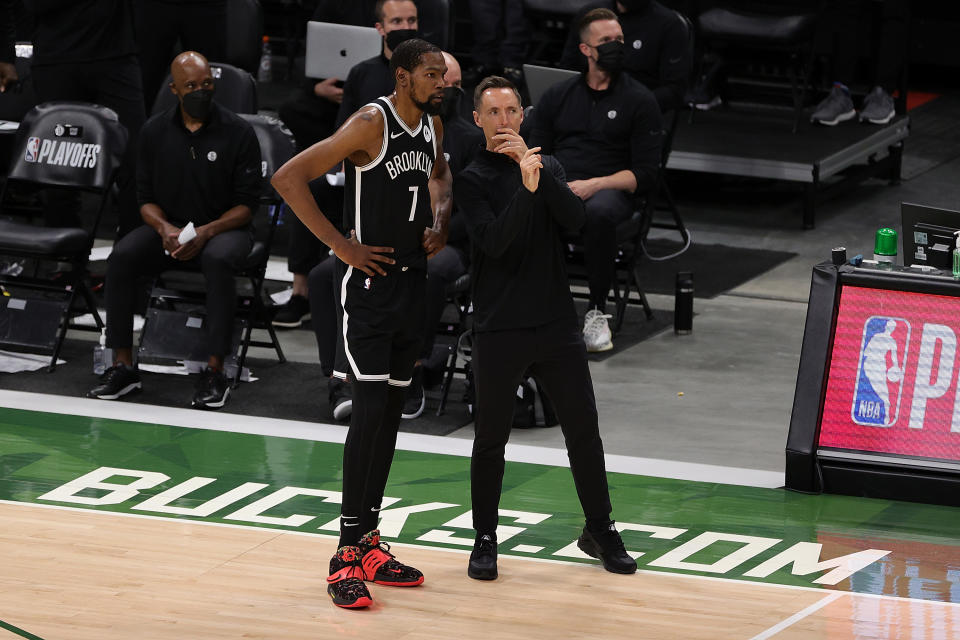 Kevin Durant and Steve Nash talk on the sideline during Game 4.