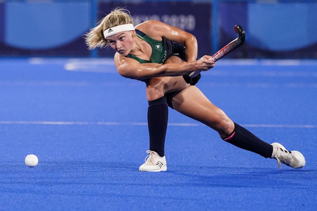 Ireland's Chloe Watkins passes the ball during a women's field hockey match against South Africa at the 2020 Summer Olympics, Saturday, July 24, 2021, in Tokyo, Japan.