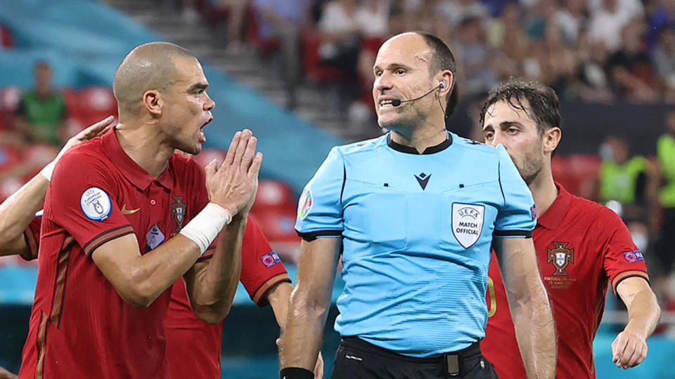 Pictured here, Portugal's Pepe appeals the decision to award a first half penalty to France. 