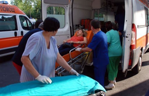 Bulgarian medics wheels a wounded woman at a hospital after an explosion at Bourgas airport. An explosion ripped through a bus carrying Israeli holiday-makers in Bulgaria and killed at least six people on Wednesday in an attack the government in Israel blamed on arch foe Iran