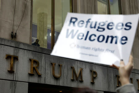 Protesters gather outside the Trump Building at 40 Wall St. to take action against America’s refugee ban in New York City, U.S., March 28, 2017. REUTERS/Lucas Jackson/Files