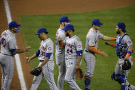 New York Mets' Wilson Ramos (40), Edwin Diaz (39), Robinson Cano (24), Robinson Chirinos, far right, and others celebrate after a baseball game against the Washington Nationals, Thursday, Sept. 24, 2020, in Washington. The Mets won 3-2. (AP Photo/Nick Wass)