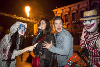 <p>Comedian Adam DeVine and his actress gal pal, Chloe Bridges, were ready to make a run for it! (Photo: Mike Danenberg/Universal Studios Hollywood) </p>