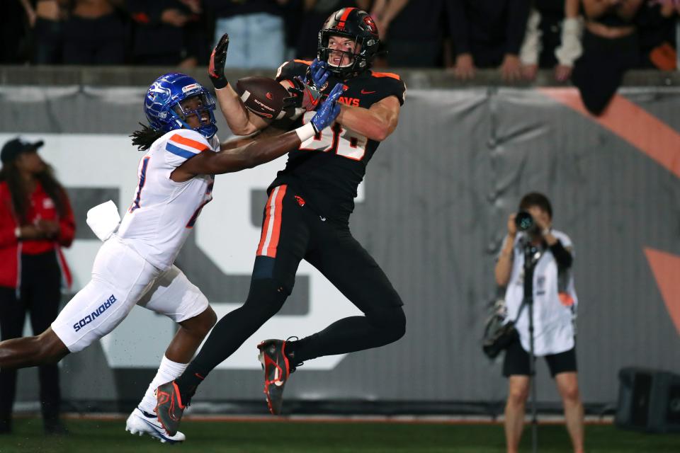 Oregon State tight end Luke Musgrave (88) scores a touchdown on a pass from quarterback Chance Nolan as Boise State cornerback Tyreque Jones (21) defends during the first half Sept. 3, 2022, in Corvallis, Ore.