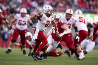 Nebraska quarterback Adrian Martinez (2) looks to pass as Wisconsin linebacker Jack Sanborn (57) defends during the first half of an NCAA college football game Saturday, Nov. 20, 2021, in Madison, Wis. (AP Photo/Andy Manis)