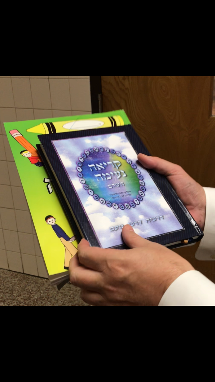 Lakewood schools attorney Michael Inzelbuch shows Yiddish and Hebrew books purchased through a state grant for private schools in the township.