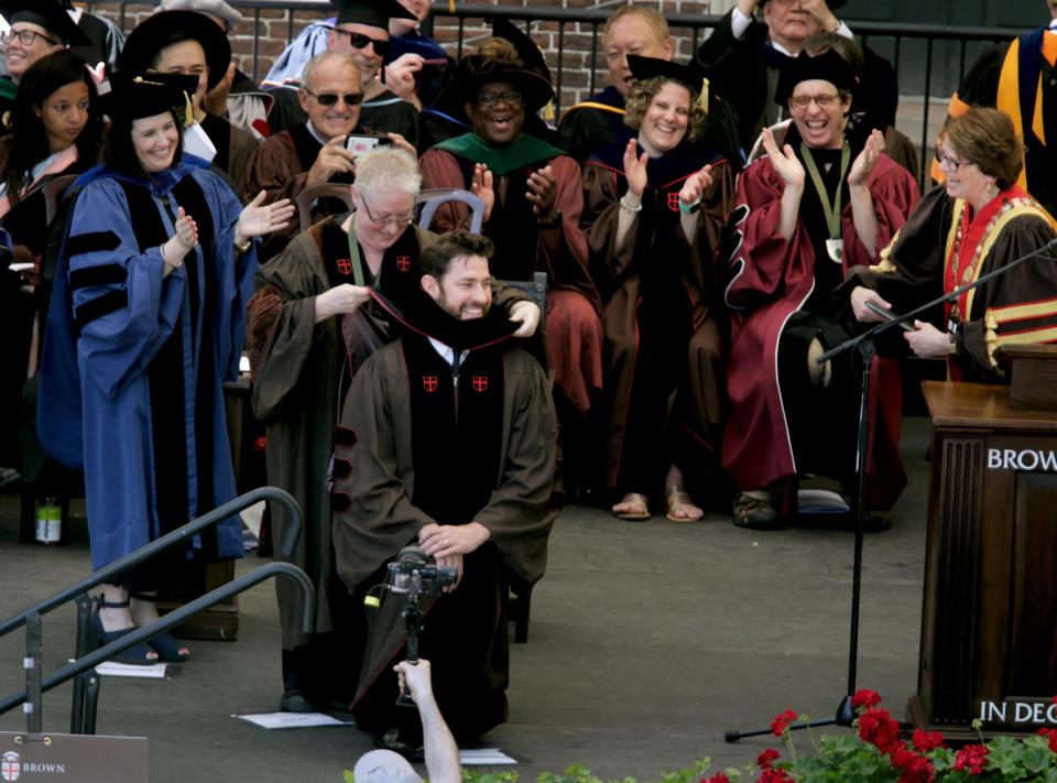 May 26, 2019:  Actor/director and Brown University Alumni, John Krasinski stoops low to receive his Honorary Doctor of Fine Arts degree on the College Green during Brown University's commencement.