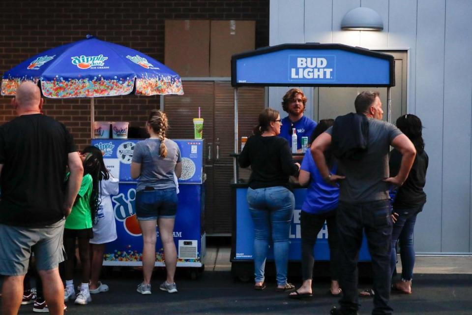 Fans line up to buy alcohol at the Wendell and Vickie Bell Soccer Complex in Lexington on Aug. 17. This summer, Kentucky Athletics Director Mitch Barnhart announced beer and seltzer drinks would be sold at all UK athletics events.