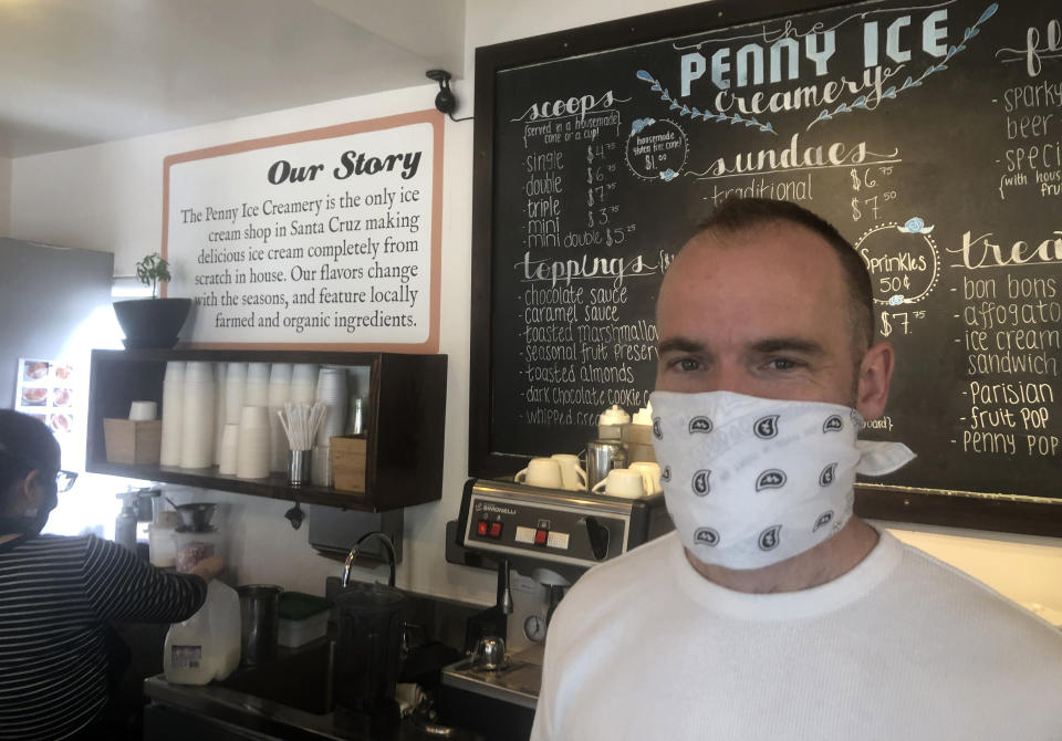 FILE - In this April 17, 2020, photo, Zachary Davis poses for a photo at The Penny Ice Creamery in Santa Cruz, Calif. California has officially recovered all of the 2.7 million jobs it lost at the start of the pandemic. State officials said Friday, Nov. 18, 2022, the state added 56,700 new jobs in October. Davis, who co-owns four ice cream locations and a cafe in the beach town of Santa Cruz, laid off 70 of his 75 employees at the start of the pandemic. Today, they have 85 workers. (AP Photo/Martha Mendoza,File)