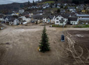 A Christmas tree stands where once house stood in the village of Schuld in the Ahrtal valley, southern Germany, Tuesday, Dec. 14, 2021. Amid the mud and debris still clogging the streets from last summer's devastating floods, residents of the Ahr Valley in western Germany are trying to spark some festive cheer with Christmas trees. (Photo/Michael Probst)