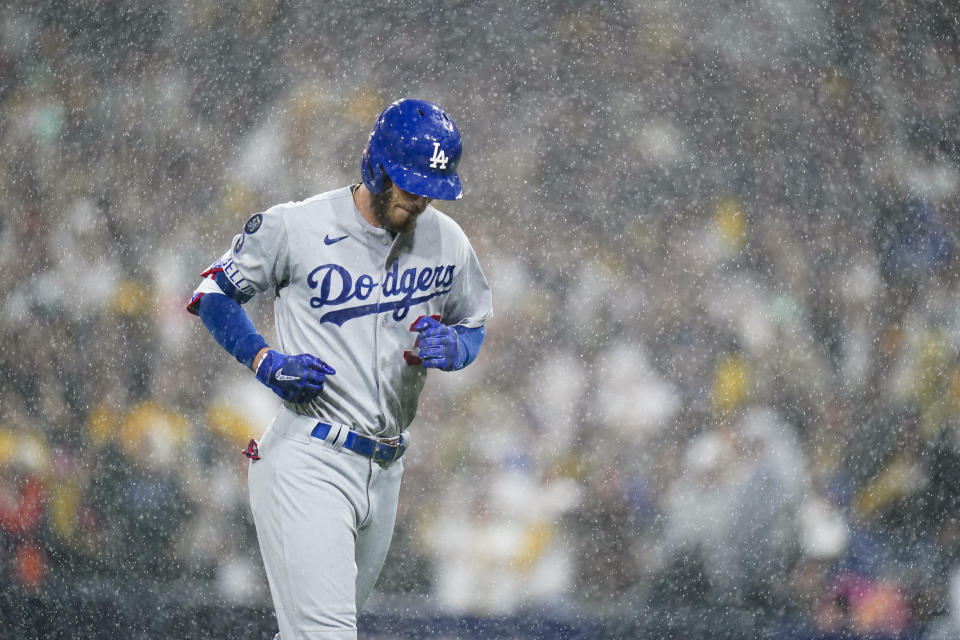 Los Angeles Dodgers' Cody Bellinger jogs back to the dugout after flying out during the eighth inning in Game 4 of a baseball NL Division Series against the San Diego Padres, Saturday, Oct. 15, 2022, in San Diego. (AP Photo/Jae C. Hong)