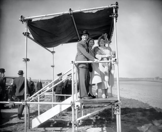 King George VI, Queen Elizabeth and Princess Margaret watch on at Copse Corner in 1950. The event was the first World Championship Formula One race 