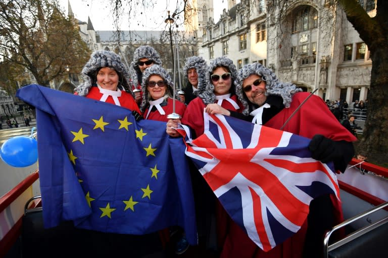 Members of the pro-European movement Britain for Europe pose outside the Supreme Court building in London on December 5, 2016