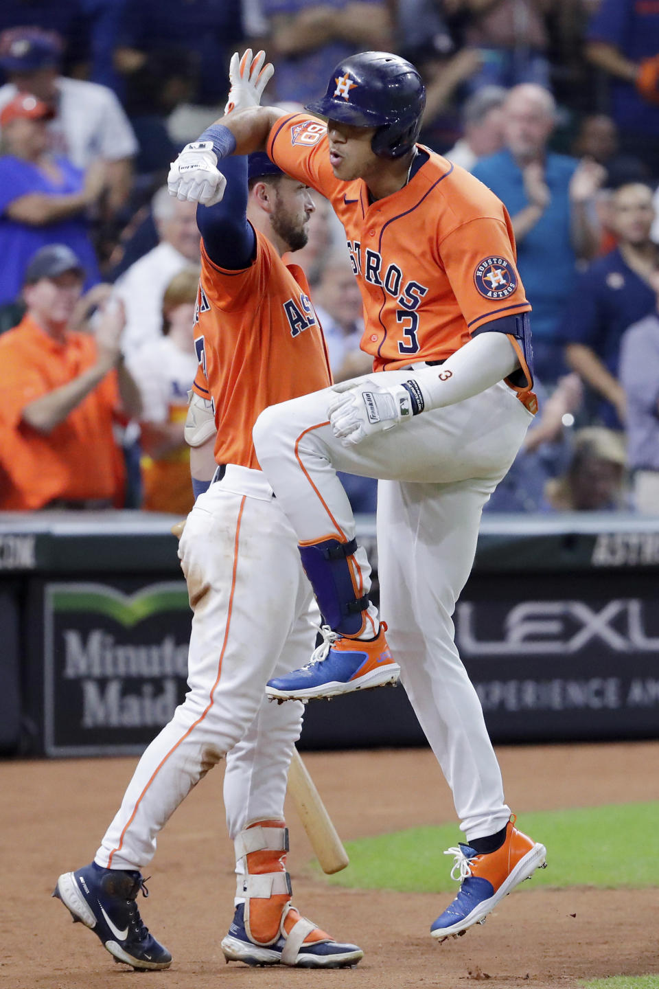 Houston Astros' Alex Bregman, left, and Jeremy Pena (3) celebrate a home run by Pena against the Los Angeles Angels during the sixth inning of a baseball game Friday, Sept. 9, 2022, in Houston. (AP Photo/Michael Wyke)