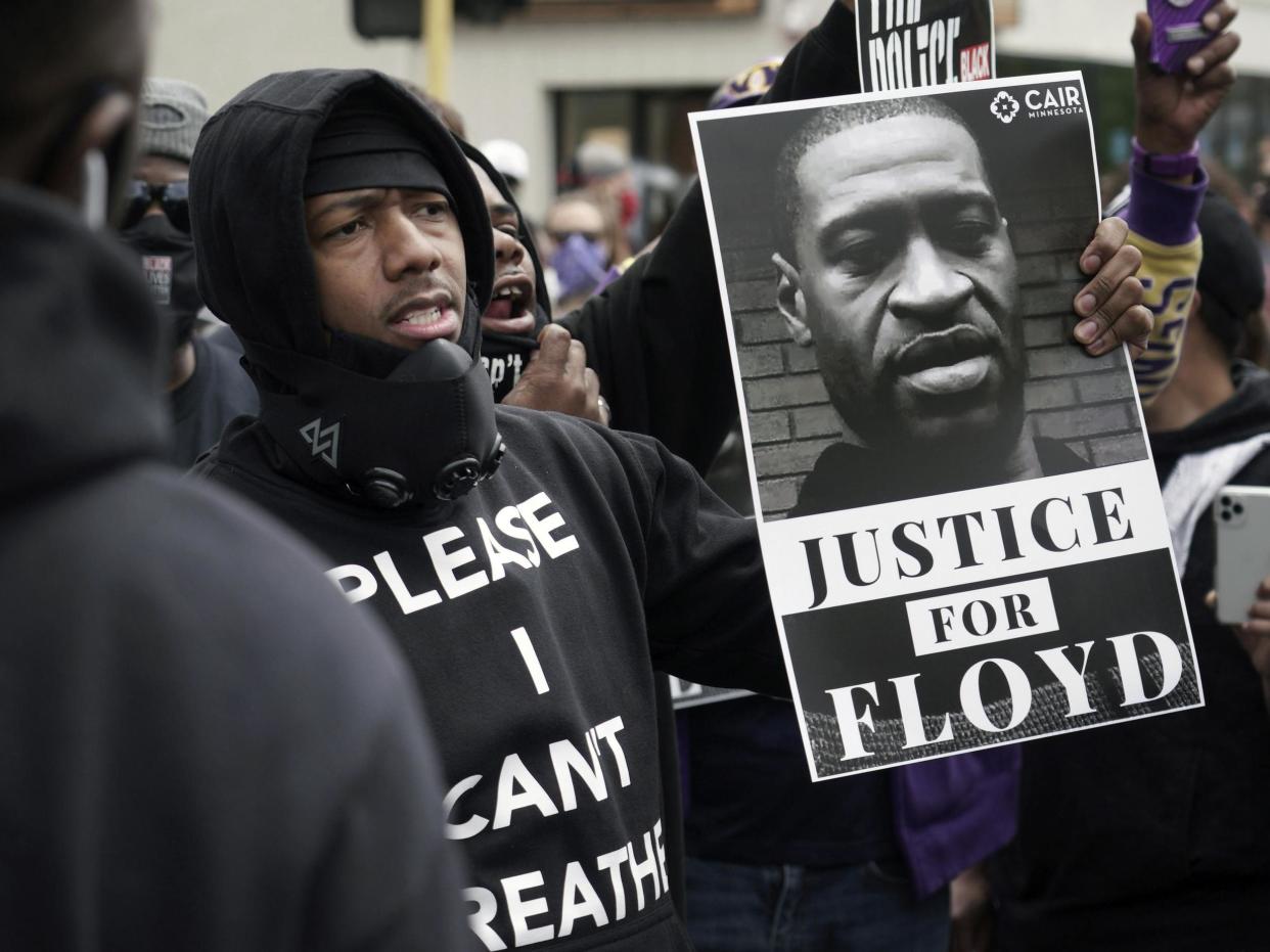 Actor and comedian Nick Cannon celebrates the memory of George Floyd and demand justice outside the Cup Foods store on Chicago Avenue: AP