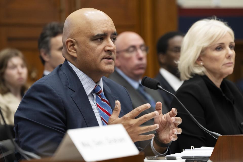 Federal Highway Administration Administrator Shailen Bhatt, left, speaks next to Jennifer Homendy, Chair of the National Transportation Safety Board, during a House Committee on Transportation and Infrastructure hearing on the federal response to the Francis Scott Key Bridge collapse, Wednesday, May 15, 2024, on Capitol Hill in Washington. (AP Photo/Jacquelyn Martin)