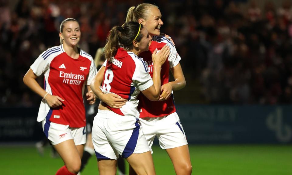 <span>Frida Maanum (centre) celebrates with Mariona Caldentey after scoring the only goal of the game.</span><span>Photograph: Richard Pelham/Getty Images</span>