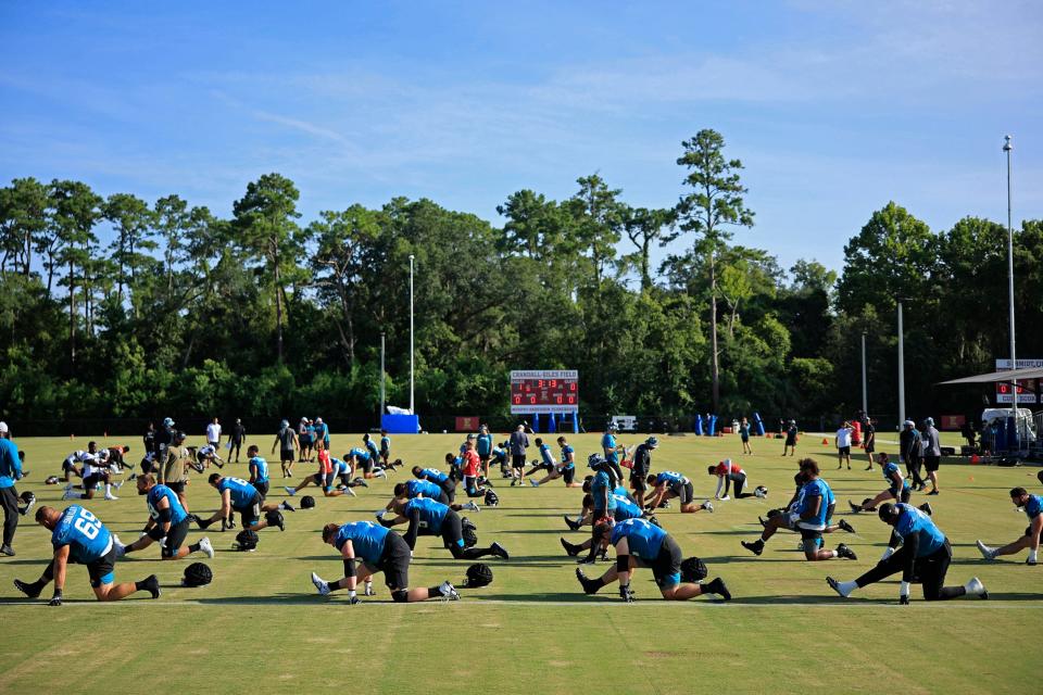 The Jaguars go through stretching on July 28 at the Episcopal School's Knight Campus.