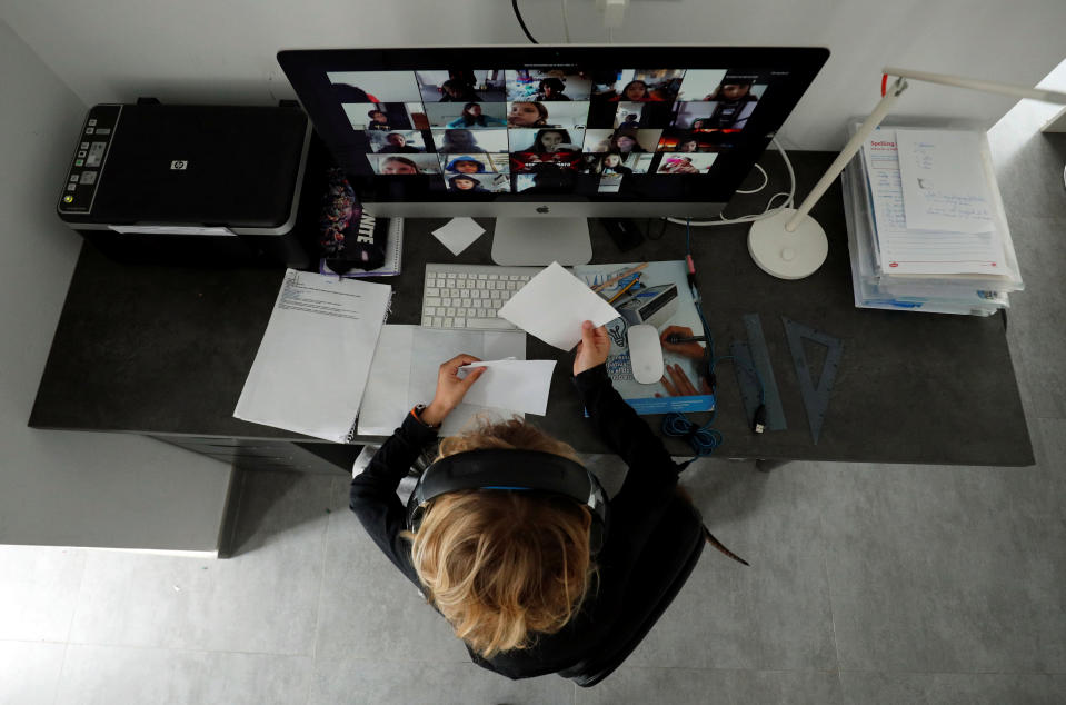 A student takes classes online with his companions using the Zoom APP at home during the coronavirus disease (COVID-19) outbreak in El Masnou, north of Barcelona, Spain April 2, 2020. REUTERS/ Albert Gea