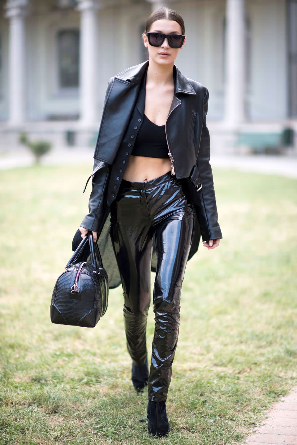 <p>In a leather jacket and latex pants during Milan Fashion Week Spring 17.</p>