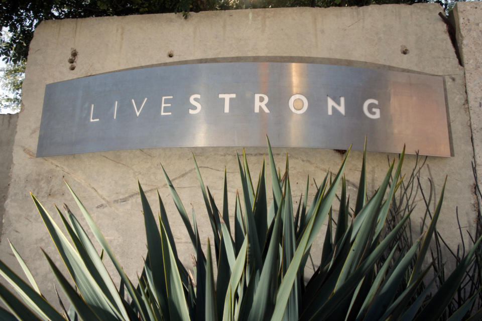 Signage for the Livestrong Foundation appears at the charity's headquarters, Sunday, Jan. 13, 2013, in Austin, Texas. In what's been billed as a "no-holds barred" session, Lance Armstrong is expected to reverse course after a decade of denials and apologize for doping, as well as offer a limited confession about his role at the head of a long-running scheme to dominate the Tour de France with the aid of performance-enhancing drugs, in an interview Monday with Oprah Winfrey. (AP Photo/Jack Plunkett)