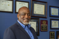 In this photo provided by the John D. and Catherine T. MacArthur Foundation, Desmond Meade stands for a portrait Monday, Sept. 13, 2021 at the Florida Rights Restoration Coalition's headquarters in Orlando, Fla. The activist whose mission is to make sure people who walk out of prison are free to walk into the voting booth is among this year's MacArthur fellows and recipients of "genius grants." (John D. and Catherine T. MacArthur Foundation via AP)