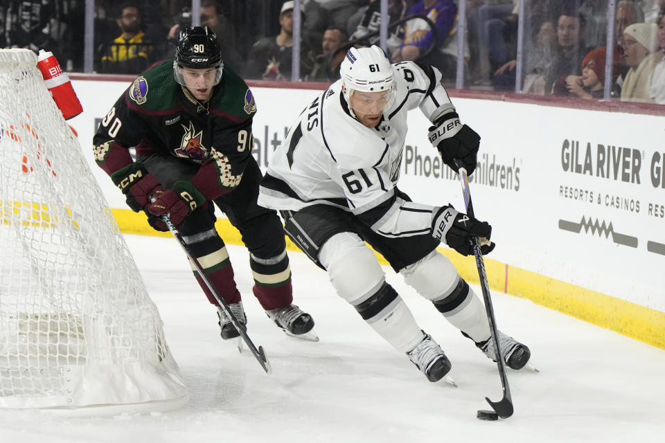 Los Angeles Kings center Trevor Lewis skates away from Arizona Coyotes defenseman J.J. Moser (90) during the third period of an NHL hockey game Friday, Oct. 27, 2023, in Tempe, Ariz. (AP Photo/Rick Scuteri)