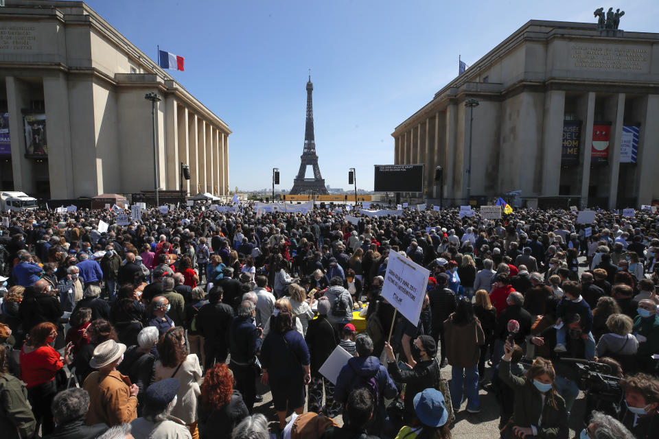 People stage a protest organized by Jewish associations, who say justice has not been done for the killing of French Jewish woman Sarah Halimi, at Trocadero Plaza near Eiffel Tower in Paris, Sunday, April 25, 2021. Thousands of people have gathered in Paris and other French cities to denounce a ruling by France's highest court that the killer of Jewish woman Sarah Halimi was not criminally responsible and therefore could not go on trial. (AP Photo/Michel Euler)