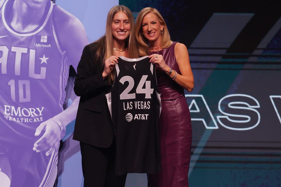 Kate Martin poses with WNBA commissioner Cathy Engelbert after being selected with the No. 18 overall pick by the Las Vegas Aces.