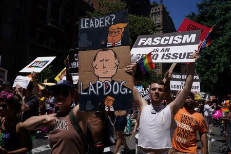 Participants take part in the LGBT Pride March in the Manhattan borough of New York City, U.S., June 25, 2017. REUTERS/Carlo Allegri