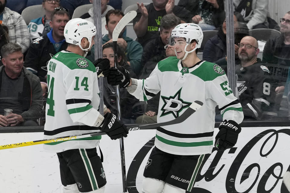 Dallas Stars center Wyatt Johnston, right, is congratulated by left wing Jamie Benn (14) after scoring against the San Jose Sharks during the second period of an NHL hockey game in San Jose, Calif., Tuesday, March 26, 2024. (AP Photo/Jeff Chiu)