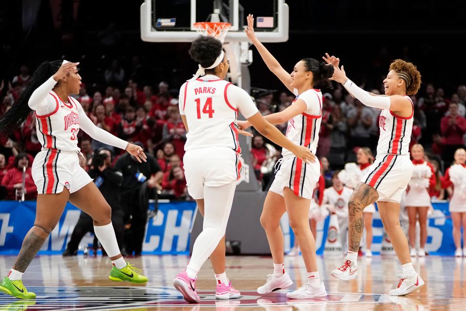 Mar 22, 2024; Columbus, OH, USA; Teammates celebrate a three pointer by Ohio State Buckeyes guard Rikki Harris (1) during the first half of the women’s basketball NCAA Tournament first round game against the Maine Black Bears at Value City Arena.