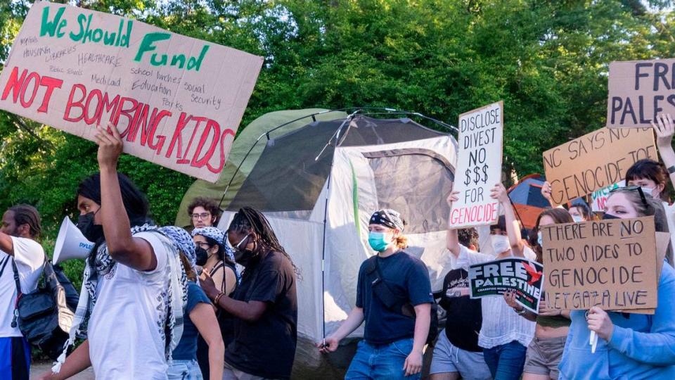 Demonstrators march outside an event attended by former UNC-Chapel Chancellor Kevin Guskiewicz during a pro-Palestinian protest and encampment at UNC Chapel Hill on Monday, April 29, 2024.